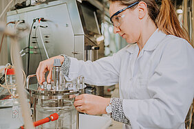 Scientist works on bioreactor