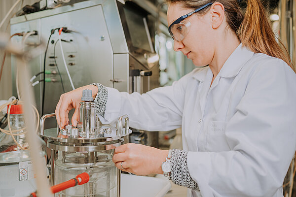 Scientist works on bioreactor