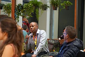 Man in the audience speaks into the microphone.